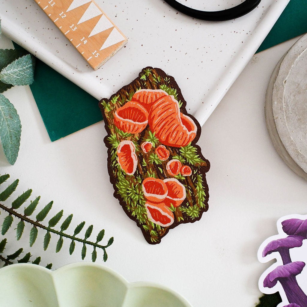 Scarlet elf cup mushrroom woven patch surrounded my decorative items
