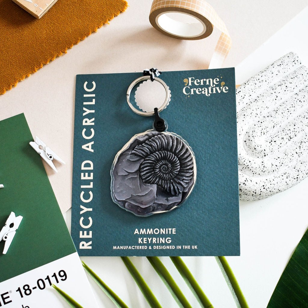 ammonite keyring on blue backing card